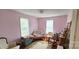 Bright bedroom with lots of light, with pink walls and hardwood floors at 600 College Ave, Rock Hill, SC 29730
