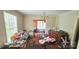 Open dining room with hardwood floors, chandelier, and lots of contents at 600 College Ave, Rock Hill, SC 29730