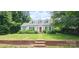 Charming home featuring a well-maintained lawn, brick accents, and a welcoming red front door at 600 College Ave, Rock Hill, SC 29730