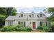 Classic home featuring dormer windows, a red front door, and well-maintained landscaping at 600 College Ave, Rock Hill, SC 29730