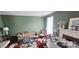 Charming green living room with hardwood floors, a fireplace, and ample natural light at 600 College Ave, Rock Hill, SC 29730