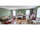 A green living room featuring hardwood floors, fireplace, lots of furniture at 600 College Ave, Rock Hill, SC 29730