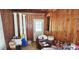 Sitting room featuring wood paneling and decorative columns, with boxes on the floor at 600 College Ave, Rock Hill, SC 29730