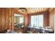Sitting room featuring wood paneling and decorative columns, with boxes on the floor at 600 College Ave, Rock Hill, SC 29730