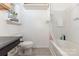 Well-lit bathroom featuring a shower-tub combo, sleek vanity with a dark countertop, and neutral color palette at 6103 Warrior Ave, Fort Mill, SC 29707