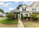 Charming townhome with manicured front yard and walkway leading to the welcoming entrance at 6103 Warrior Ave, Fort Mill, SC 29707