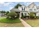 Inviting townhome with a well-maintained lawn and pathway to the front door at 6103 Warrior Ave, Fort Mill, SC 29707
