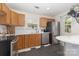 Functional kitchen with stainless steel appliances, warm wood cabinetry, and a bright, clean aesthetic at 6103 Warrior Ave, Fort Mill, SC 29707