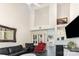 Open living room with high ceilings, decorative furnishings, and large windows for natural light at 6103 Warrior Ave, Fort Mill, SC 29707