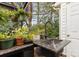 Exterior sink area, lush greenery, granite counters, and a black faucet at 6103 Warrior Ave, Fort Mill, SC 29707