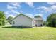 Well-maintained backyard featuring green grass, and a patio with grill and seating at 613 Gold Hill Dr, Salisbury, NC 28146