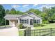 Inviting front exterior showcasing gray siding, black shutters, green grass and a covered carport at 613 Gold Hill Dr, Salisbury, NC 28146