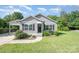 Charming one-story home featuring a gray exterior, well-manicured lawn, and a convenient carport at 613 Gold Hill Dr, Salisbury, NC 28146