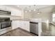 Modern kitchen featuring white cabinets, stainless steel appliances, and granite countertops at 613 Gold Hill Dr, Salisbury, NC 28146