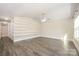 Spacious living room with custom shelving, vaulted ceilings and neutral color scheme at 613 Gold Hill Dr, Salisbury, NC 28146