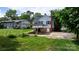 A home with a carport, leading to the backyard with some shade from nearby trees at 626 1St Se Ave, Hickory, NC 28602