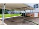 The carport has a concrete floor and white support beams at 626 1St Se Ave, Hickory, NC 28602