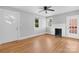 Bright living room with hardwood floors, fireplace, ceiling fan, and plenty of natural light at 626 1St Se Ave, Hickory, NC 28602