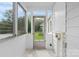 Sunroom with multiple windows and a view of the home's yard at 626 1St Se Ave, Hickory, NC 28602