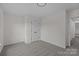 Neutral bedroom with gray carpeting and a double door closet at 7213 Baniff Cir, Charlotte, NC 28277