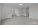 Bonus room with multiple doors and neutral carpeting at 7213 Baniff Cir, Charlotte, NC 28277
