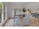 Bright home office featuring a modern desk, neutral decor, stylish artwork, and lots of natural light at 7213 Baniff Cir, Charlotte, NC 28277