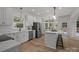 Bright kitchen with an island, stainless steel appliances, and a view to the breakfast nook and backyard at 7213 Baniff Cir, Charlotte, NC 28277