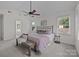 Bright main bedroom with a ceiling fan, neutral color scheme, and ensuite bath at 7213 Baniff Cir, Charlotte, NC 28277