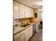 Well-equipped kitchen with granite countertops, stainless steel sink, and bright lighting at 7526 Holly Grove Ct, Charlotte, NC 28227