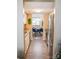 Galley kitchen leading to a dining area with stainless steel appliances and stylish finishes at 7526 Holly Grove Ct, Charlotte, NC 28227