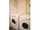 Clean laundry room featuring a modern washer and dryer set and shelving at 7526 Holly Grove Ct, Charlotte, NC 28227