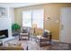 Cozy living room with fireplace, ample natural light, and modern decor for comfortable living at 7526 Holly Grove Ct, Charlotte, NC 28227