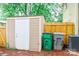 Backyard shed offers extra storage and garbage bins on side of home at 7526 Holly Grove Ct, Charlotte, NC 28227