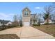 Charming two-story home featuring a one-car garage and a welcoming front porch at 834 N Flint St, Lincolnton, NC 28092