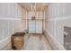 Spacious garage with concrete flooring and modern lighting fixtures and door; trash bin included at 834 N Flint St, Lincolnton, NC 28092