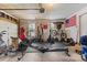 Organized garage transformed into a functional gym space with multiple bikes and work out equipment at 9637 Brookmere Ln, Charlotte, NC 28214