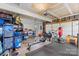 Garage with an array of storage solutions, worktable, and exercise equipment, maximizing space and functionality at 9637 Brookmere Ln, Charlotte, NC 28214