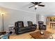 Open-concept living space with hardwood floors and adjacent kitchen area at 9637 Brookmere Ln, Charlotte, NC 28214