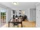 The living room features wood flooring, a fireplace, and access to the back deck at 9637 Brookmere Ln, Charlotte, NC 28214