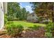 An expansive backyard featuring a wooden deck and lush lawn, providing a serene outdoor retreat at 1002 Hollyhedge Ln, Indian Trail, NC 28079