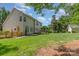 The backyard boasts a wooden deck, garden shed, and expansive lawn, perfect for relaxation and outdoor activities at 1002 Hollyhedge Ln, Indian Trail, NC 28079