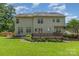 The backyard features a wooden deck and expansive lawn, perfect for relaxation and outdoor activities at 1002 Hollyhedge Ln, Indian Trail, NC 28079