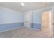 Comfortable bedroom featuring plush carpeting, a double door closet and neutral paint at 1002 Hollyhedge Ln, Indian Trail, NC 28079