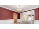 Formal dining room enhanced with detailed trim work, a stylish chandelier, and connections to the kitchen and other living spaces at 1002 Hollyhedge Ln, Indian Trail, NC 28079