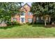 Charming brick two-story home with well-manicured lawn and blue shutters for a classic and inviting curb appeal at 1002 Hollyhedge Ln, Indian Trail, NC 28079
