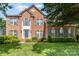 Charming brick two-story home with well-manicured lawn and blue shutters for a classic and inviting curb appeal at 1002 Hollyhedge Ln, Indian Trail, NC 28079