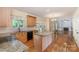 Charming kitchen featuring granite countertops, stainless steel appliances, and hardwood flooring at 1002 Hollyhedge Ln, Indian Trail, NC 28079