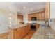 Well-equipped kitchen features an island, stainless steel appliances, and granite countertops at 1002 Hollyhedge Ln, Indian Trail, NC 28079