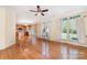 Open concept living room that joins the kitchen, and has many windows and hardwood floors at 1002 Hollyhedge Ln, Indian Trail, NC 28079