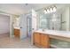 Bright main bathroom featuring double sinks, ample counter space, and a glass enclosed shower at 1002 Hollyhedge Ln, Indian Trail, NC 28079